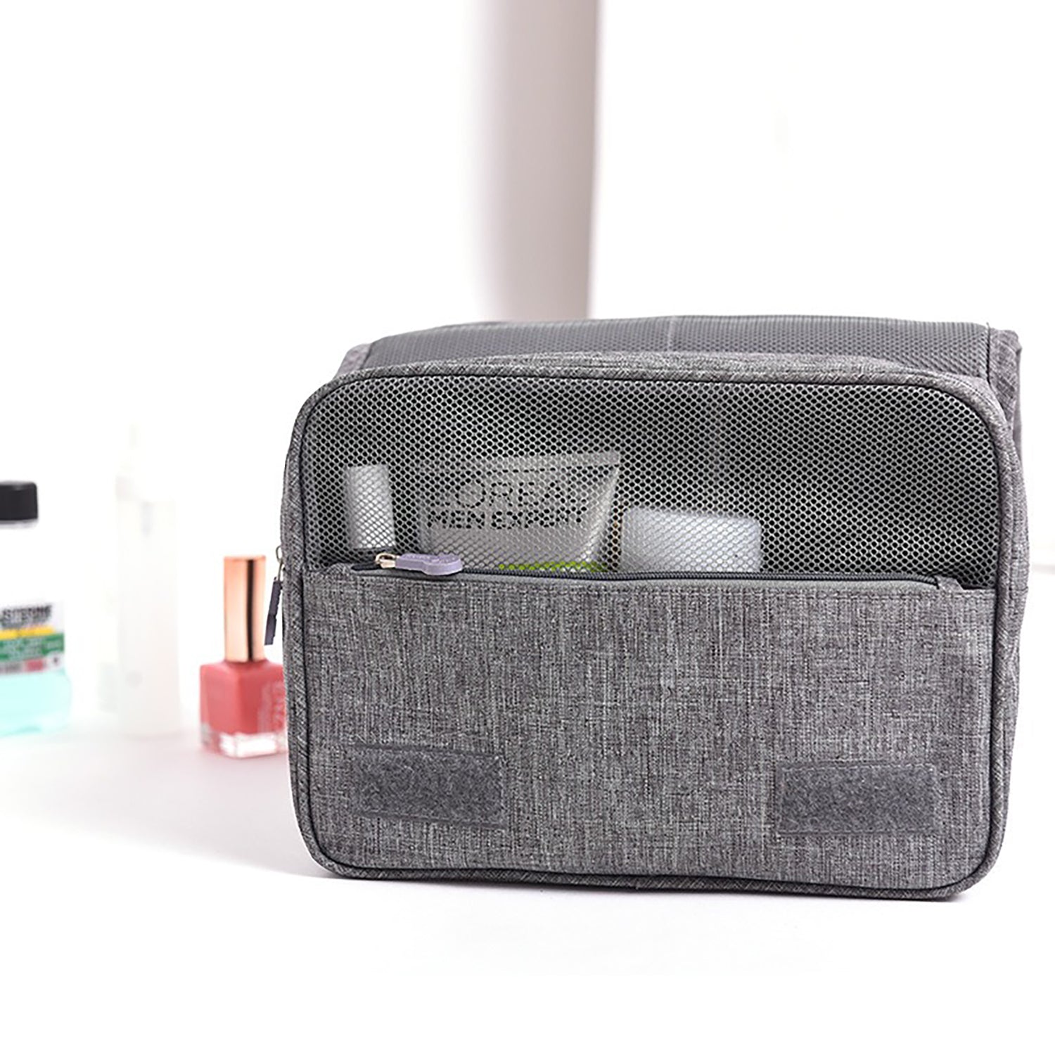 Hanging toiletry bag open with waterproof pocket